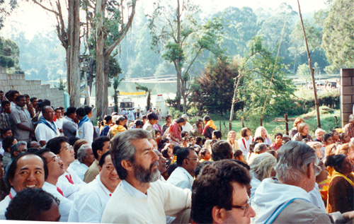 Men waiting for entry through gate to darshan compound